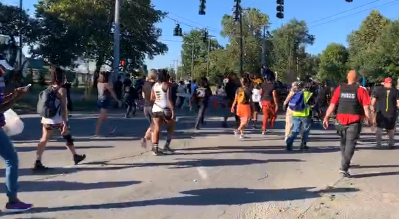 Louisville protesters march around Churchill Downs on Derby day